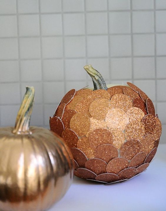 a spray paint copper pumpkin and a copper glitter penny pumpkin for the fall and Thanksgiving