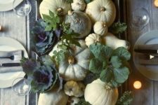 19 a rustic harvest Thanksgiving centerpiece with white and green pumpkins, various kinds of cabbage and candles around
