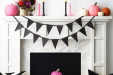 22 a colorful fireplace and mantel with bright candles, pumpkins and flowers in a vase for Halloween