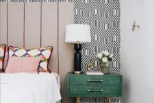 22 printed geometric wallpaper and a printed rug help creating a cool mid-century modern look