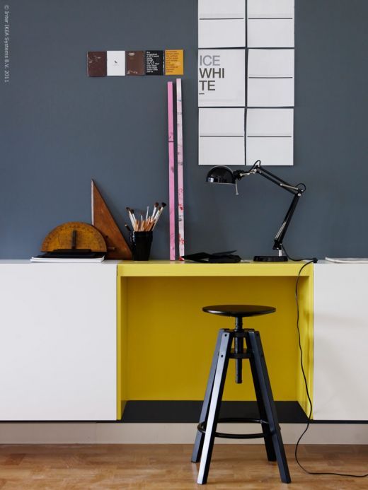 a creative way to rock color blocking at your home office with a graphite grey wall and a yellow touch on the desk
