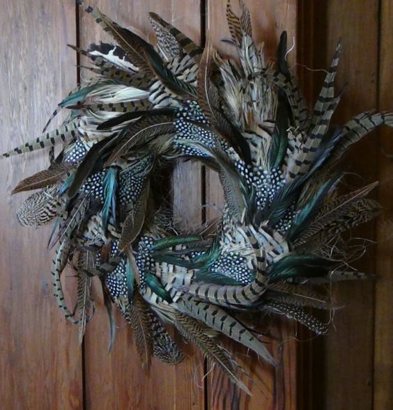 a lush feather wreath is great for Halloween decor and is sure to give a boho chic feel to the space