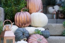 23 place a batch of pumpkins on the stairs and include copper ones plus a copper lantern to make it more stylish