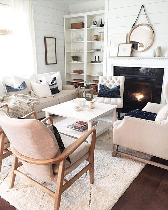 several different chairs and a sofa, a coffee table for a comfortable space