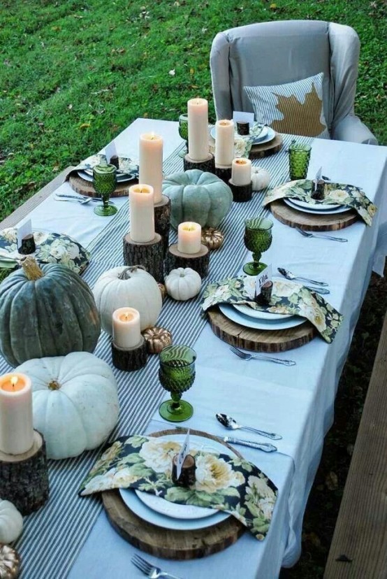 green heirloom pumpkins, green glasses and colorful floral print napkins dot the table with touches of color