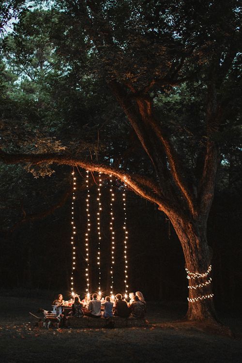 if you have a large tree around, use it for lighting, cover it with lights and hang them donw from the branches