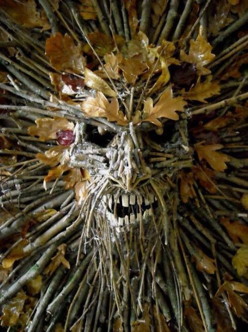 natural decor cna be spooky, just buy one plastic dollar store mask base, glue on branches and leaves