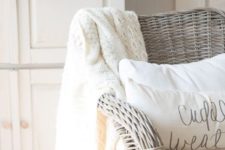 25 neutral decor with a wheat wreath, a creamy crochet blanket and creamy pillows for fall and Thanksgiving