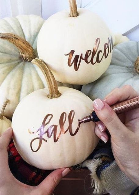 Take usual or faux pumpkins and decorate them with a copper pen   so easy and so chic