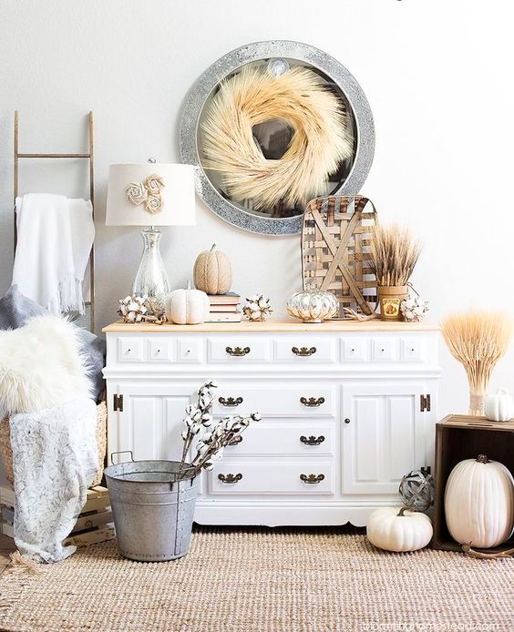 rustic fall or Thanksgiving console styling with wheat, pumpkins, cotton and faux fur for a chic look