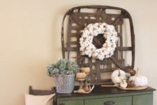 26 simple and natural styling, with fabric pumpkins, a cotton wreath, potted greenery and antlers