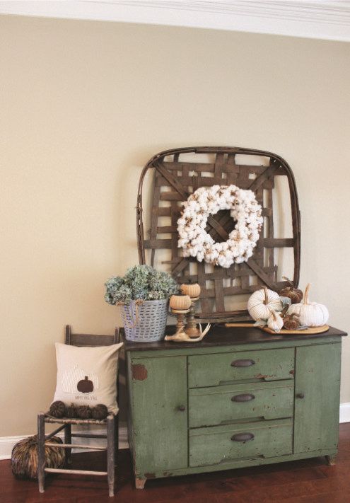 simple and natural styling, with fabric pumpkins, a cotton wreath, potted greenery and antlers
