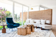 02 Her’es an outdoor-indoor sitting nook with creative coffee tables and comfy mid-century modern furniture