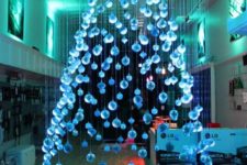 02 a large and beautiful ice blue suspended Christmas tree of ornaments floating above the floor