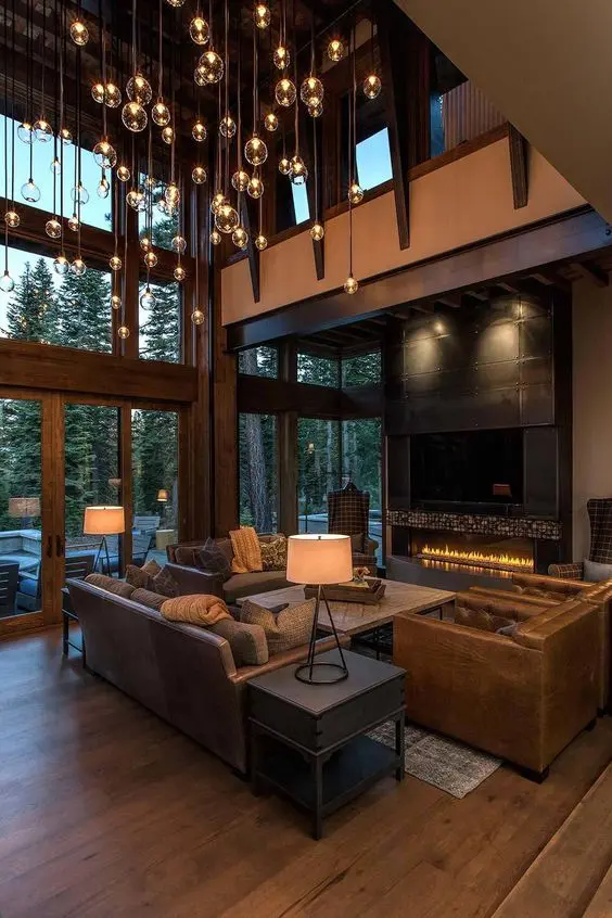 a modern rustic luxurious home with a double height ceiling and a whole hanging light installation