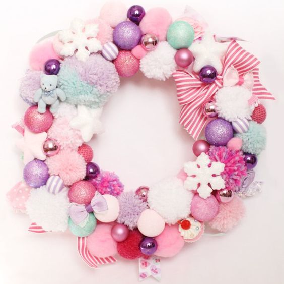 a sweet pastel Christmas wreath of pompoms, ornaments, bows and snowflakes of soft shades