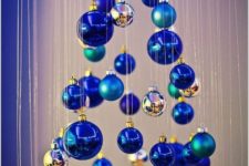 03 a small Christmas tree of matte and shiny blue ornaments and little silver ones is a whimsy and creative DIY idea