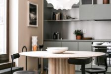 03 a soft pastel minimalist kitchen in blush, beige and with touches of muted green plus black chairs