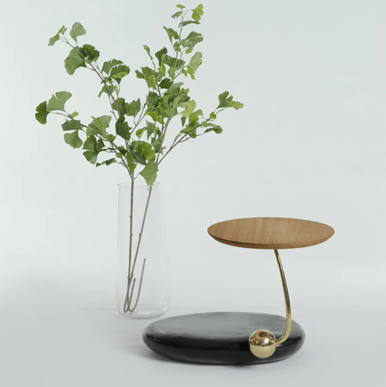 This chic table is also included in the collection, it's composed of stone and wood