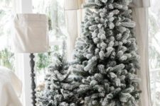 04 a duo of snowy Christmas trees with no decor is a great idea for a farmhouse, Scandinavian or contemporary space