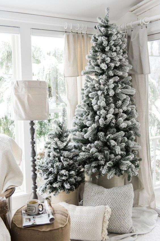 a duo of snowy Christmas trees with no decor is a great idea for a farmhouse, Scandinavian or contemporary space