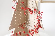 04 a pegboard Christmas tree decorated with himmeli ornaments and berries placed on faux fur is a great tabletop idea