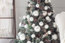 04 a rustic Christmas tree with pearly ornaments, snowflakes, snowy pinecones, burlap and cotton flowers