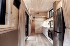 small kitchen design with a window backsplash