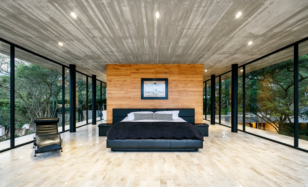 The master bedroom is glazed from all sides to make the owners feel like outdoors