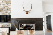 05 a modern rustic space with jute, fur, wood and stone in decor plus cowhide chairs