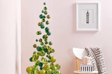 05 a small and elegant suspended Christmas tree of emerald and gold ornaments, shiny and glitter ones is an airy idea