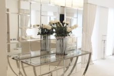 05 bring a fun glam feel to your space adding such a geometric mirror wall and a glass console table