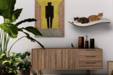06 The cat shelf focuses your cat’s jumping desires to a single and comfortable space, it’s enough for two kitties