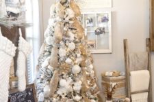 06 a snowy rustic Christmas tree with lots of burlap ribbons, burlap snowflake ornaments and white ornaments