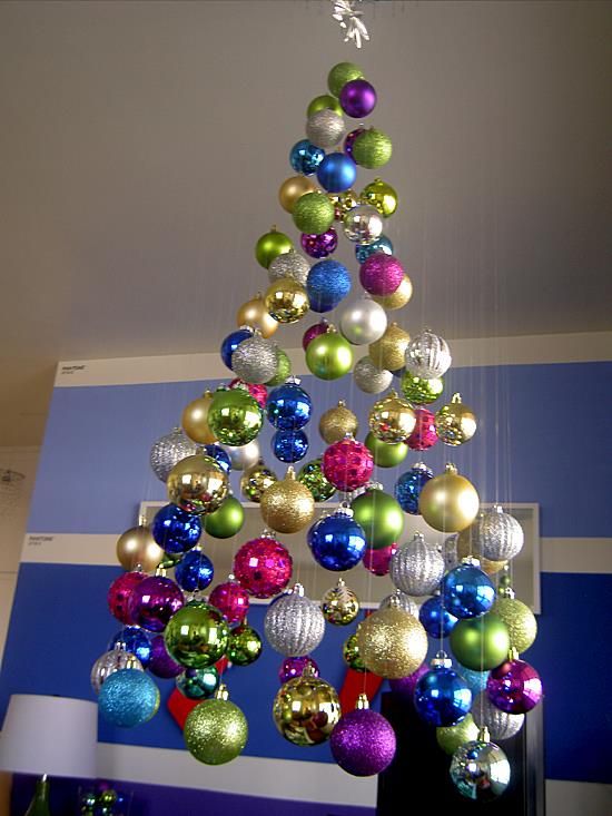 a super colorful floating Christmas tree of bright ornaments, shiny, matte and glitter ones