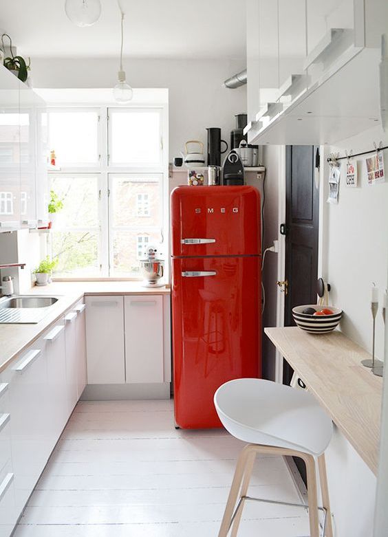 spruce up a neutral space with a bright red fridge from SMEG, such a fun idea