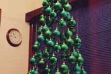 07 a small suspended Christmas tree of shiny, matte and glitter emerald ornaments hanging on different heights