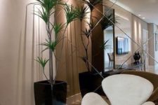 07 a smoked mirror wall adds color and chic to the space raising it to a new level and making it more special