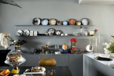 08 The kitchen is also an art-filled space, an open shelving unit shows off gorgeous ceramics