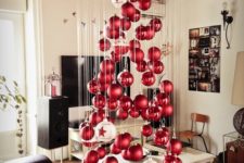 08 a large floating Christmas tree of matte and shiny Christmas ornaments and a couple of large white ones