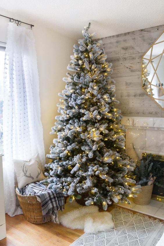 a flocked tree decorated with only lights for those who want maximize to a truly natural look