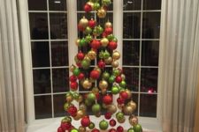 09 a suspended Christmas tree of ornaments in traditional Christmas colors, green, red and gold is a fun idea