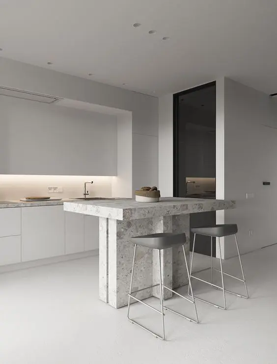 off-whites and greys make the kitchen airy, a stone kitchen island highlights the texture