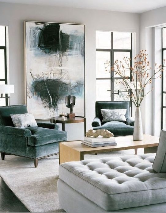this large artwork perfectly matches the color scheme and adds a masculine feel to the room