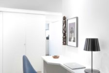 10 The home office nook is done comfortable, with a stable desk, a stylish chair and refined artworks