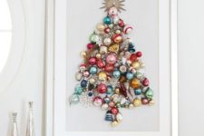 10 a beautiful colorful Christmas tree made of ornaments on a sign is a chic idea of an additional Christmas tree