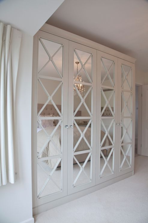 A chic refined wardrobe with cross framing is ideal for a girlish or vintage inspired bedroom
