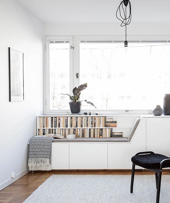 create a window seat to match the style of your home office, place books next to it if needed