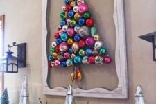 12 a colorful ornament Christmas tree formed right on the wall and highlighted with a vintage frame is a creative idea