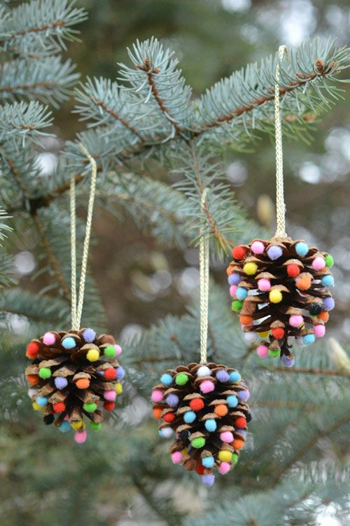 take large pinecones and glue some colorful pompoms to them - these are fun and natural Christmas decorations